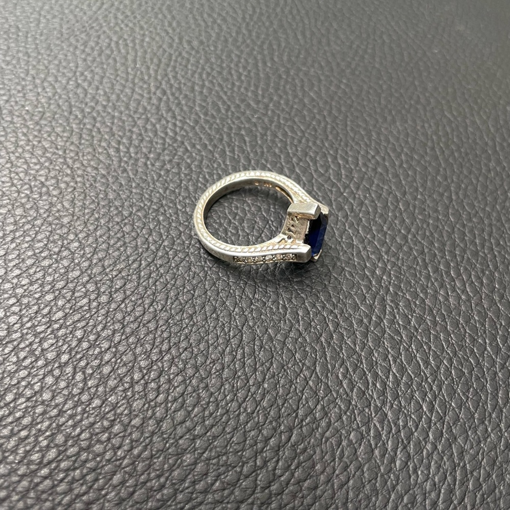 Sterling silver ring with some sort of crystals in the sides.